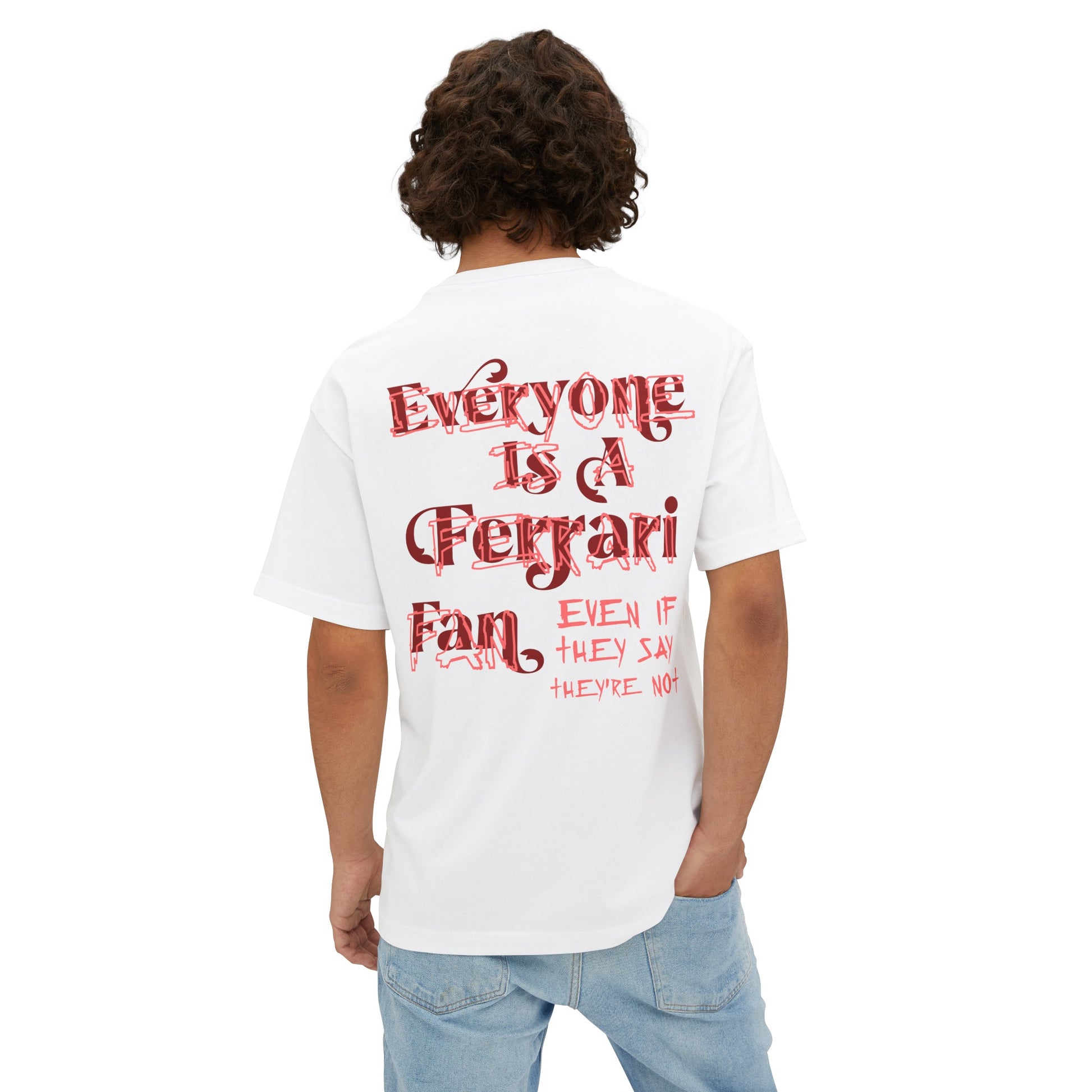White oversized T-shirt of Forza Ferrari. The t-shirt reads Sebastian Vettel's words - Everyone is a Ferrari fan, even if they say they're not. The t-shirt is made from French Terry cotton. Forza Ferrari is the most popular celebration chant among Tifosi and Scuderia Ferrari drivers alike.