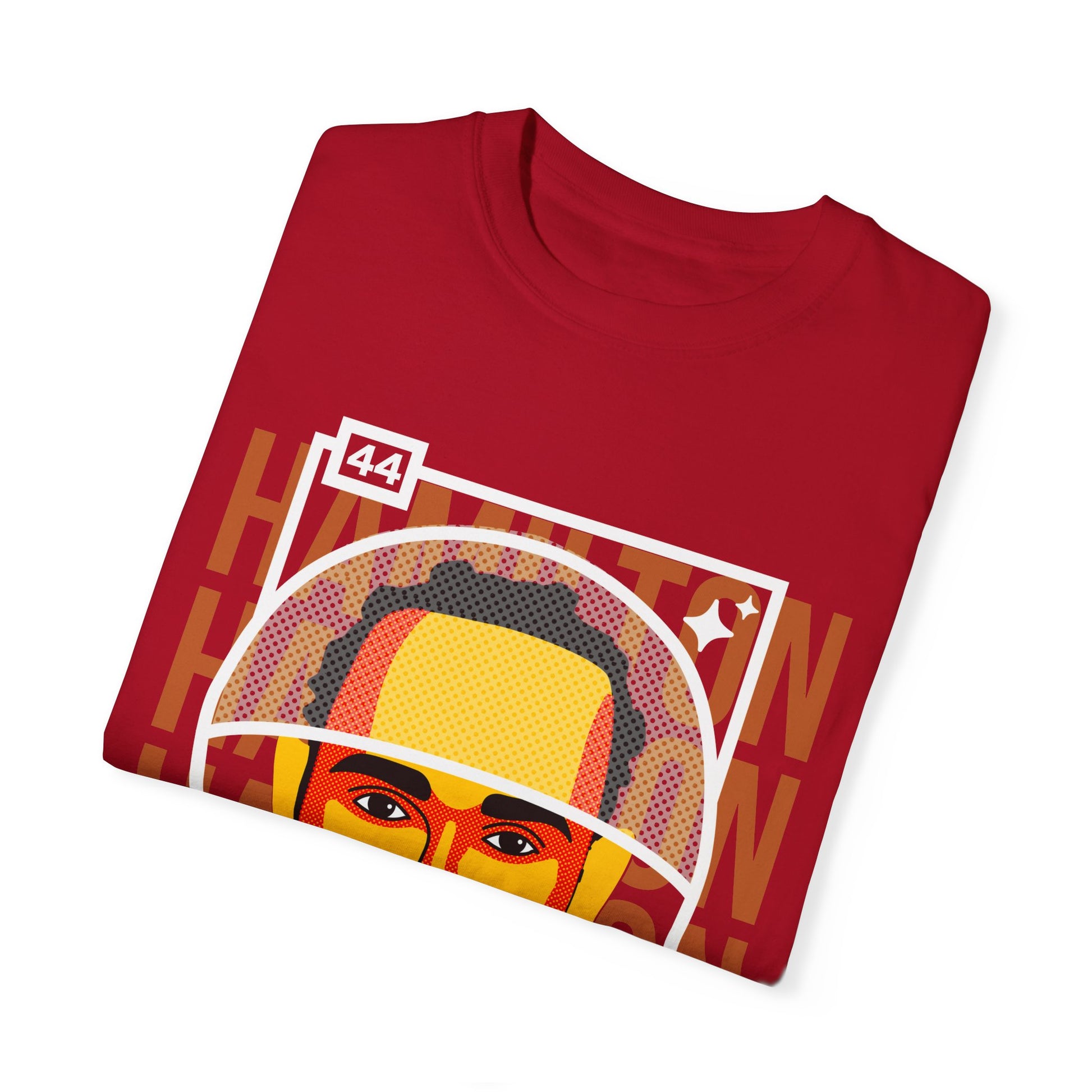 Folded red Lewis Hamilton T-shirt. Lewis Hamilton is a seven time world champion in Formula 1. He drives for Mercedes Benz AMG F1 and set to drive for Scuderia Ferrari in 2025. Sir Lewis Hamilton is widely considered as the greatest of all time. He is on the hunt for the 8th title, that was stolen from him in Abu Dhabi 2021. Buy this t-shirt and celebrate the amazing career of Lewis Hamilton.
