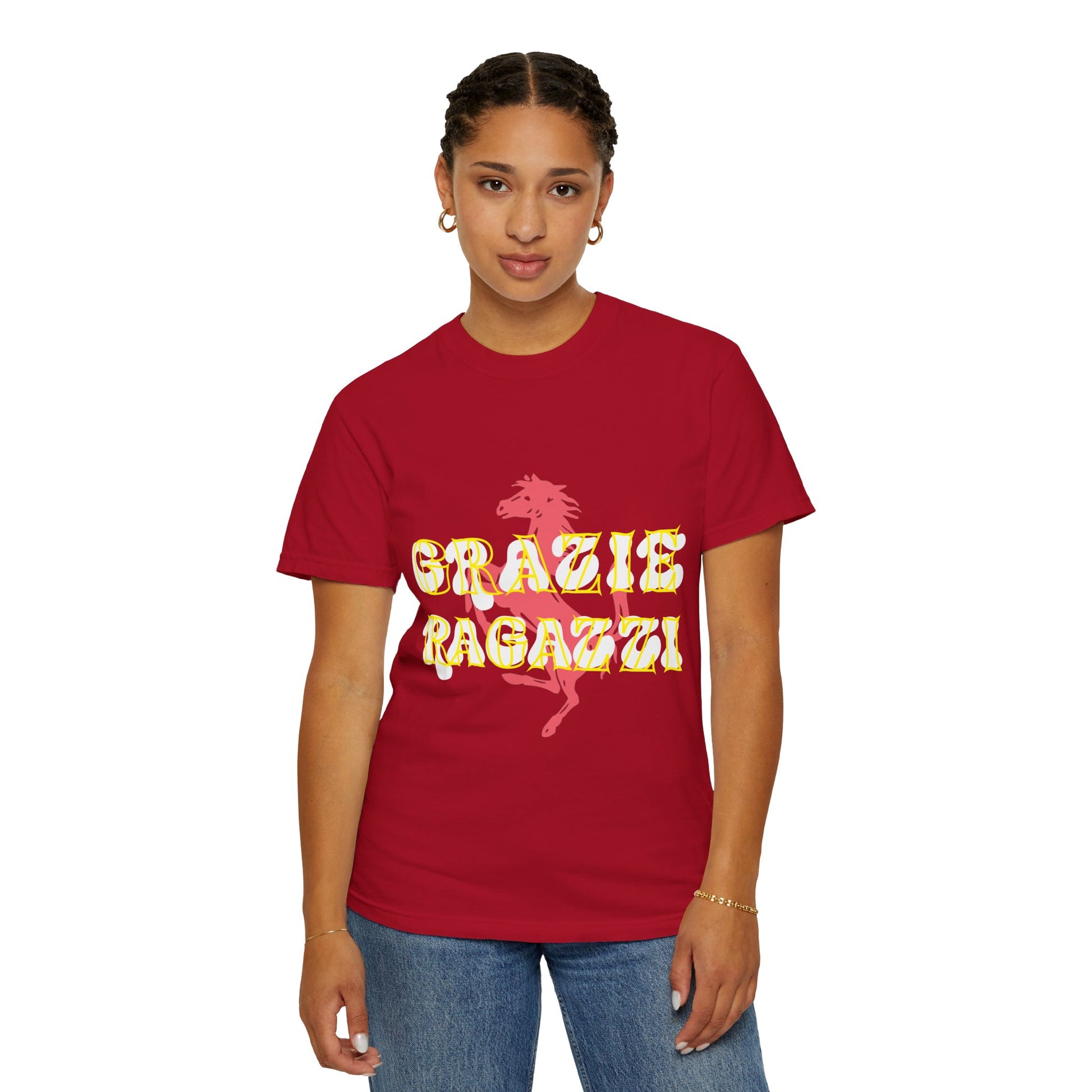 Female model wearing Red Scuderia Ferrari T-shirt which says Grazie Ragazzi. Grazie Ragazzi is a common celebration amongst the Tifosi, made popular by Sebastian Vettel. Sebastian Vettel is a 4 time World Champion in Formula 1. Scuderia Ferrari is the most successful team in Formula 1 with 16 titles. Buy this T-shirt now to show your support for Ferrari.