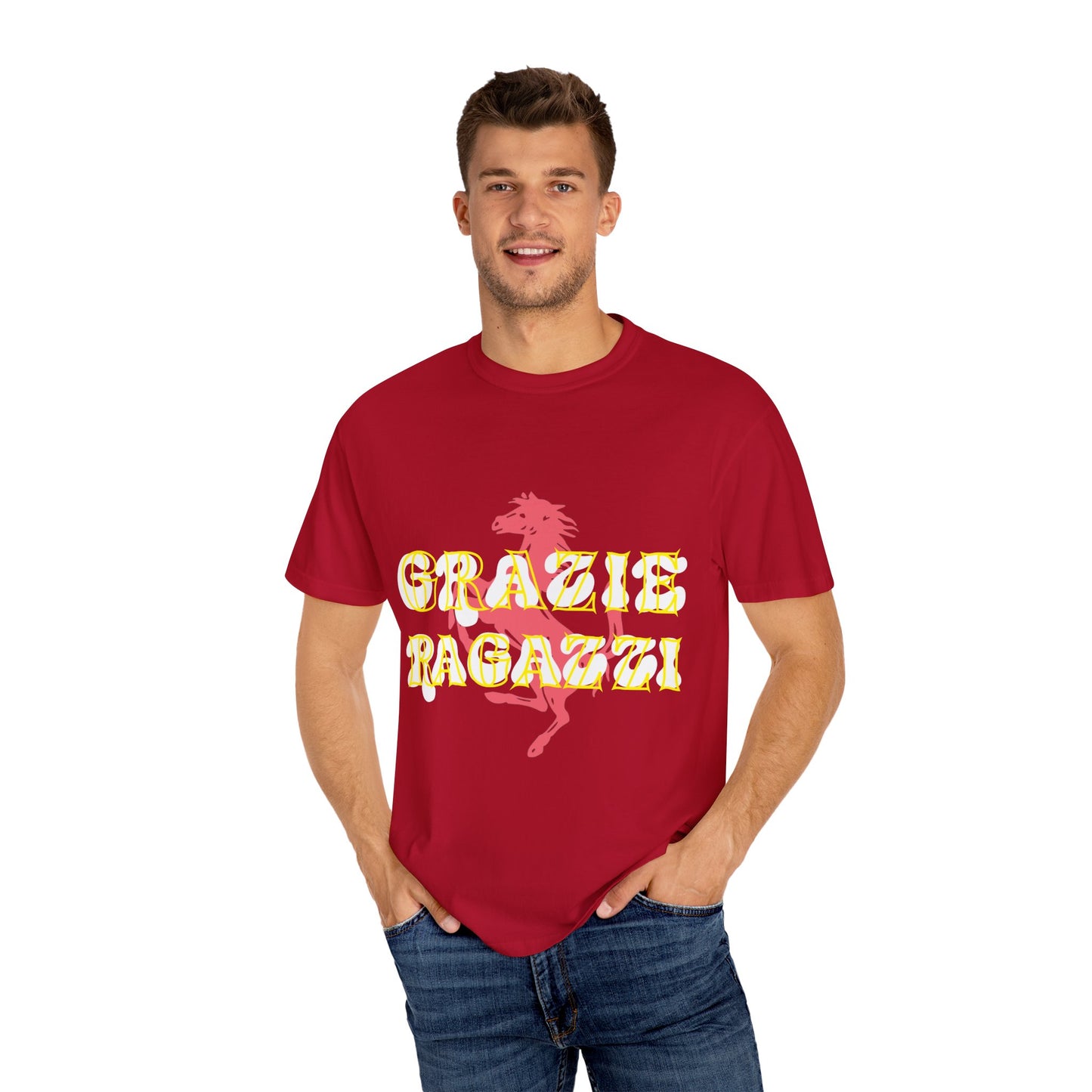 Male model wearing Red Scuderia Ferrari T-shirt which says Grazie Ragazzi. Grazie Ragazzi is a common celebration amongst the Tifosi, made popular by Sebastian Vettel. Sebastian Vettel is a 4 time World Champion in Formula 1. Scuderia Ferrari is the most successful team in Formula 1 with 16 titles. Buy this T-shirt now to show your support for Ferrari.