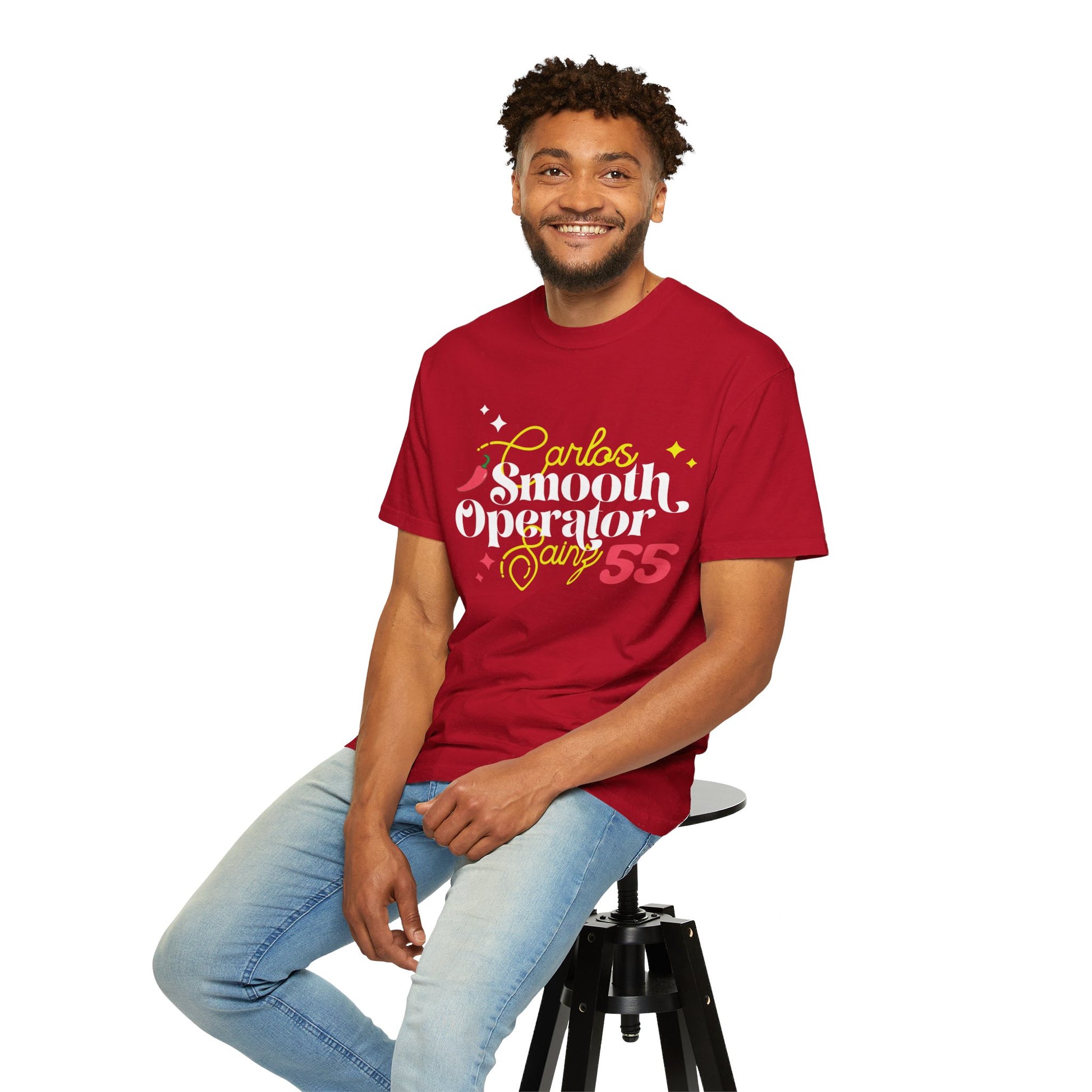 Male model wearing red oversized t-shirt of Carlos Sainz Smooth Operator with his racing number 55. Shop this comfortable t-shirt and celebrate your love for Carlos and Scuderia Ferrari!