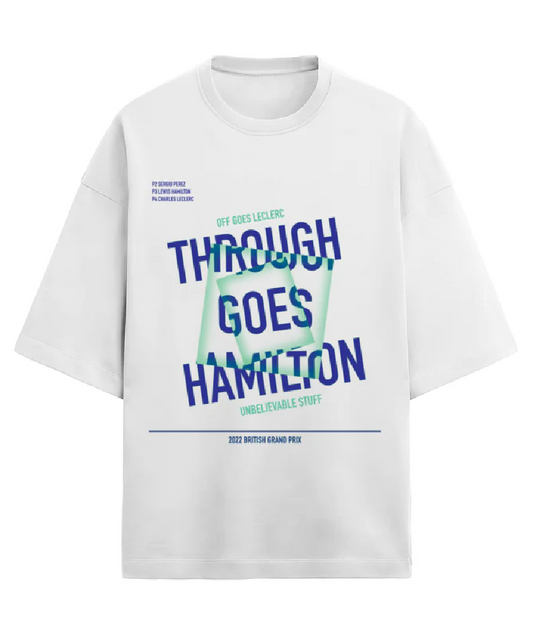 White 'Through Goes Hamilton' T-shirt. This t-shirt is based on one of Formula 1's most iconic commentary in recent years by David Croft. In 2021, at the British Grand Prix, as Charles LeClerc was battling Sergio Perez, Lewis Hamilton overtook them both in breathtaking style which led to this moment. Buy this Lewis Hamilton T-shirt now!